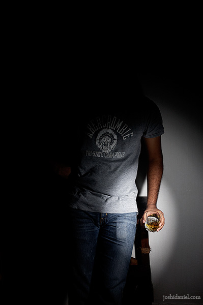 Portrait of male model Siddharth Reghunath holding whisky glass
