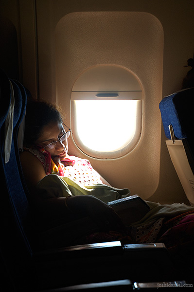 Candid portrait of a woman sleeping on board Air India flight
