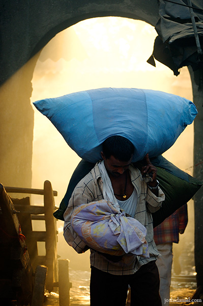 A washer man coming out of the dhobi ghat in Mahalaxmi, Mumbai, India