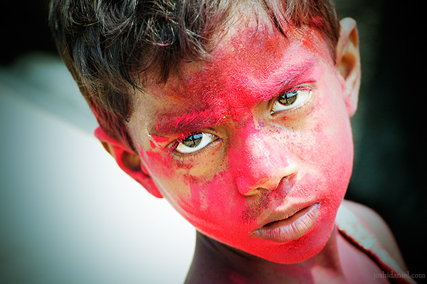 Portrait of a gazing girl taken during holi the festival of colors from Versova beach, Mumbai, India