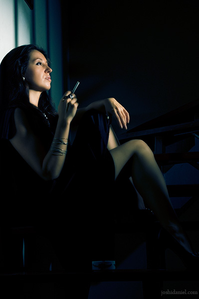 Portrait of a female model holding cigarette