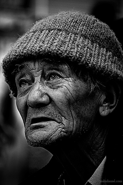 Black and white street portrait of an old man from Mcleod Ganj, Dharamsala