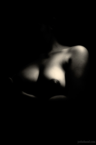 Low-key black and white female fine art nude