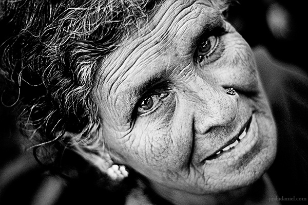 A rose seller as sparkling as her eyes from Dadar flower market, Mumbai, India