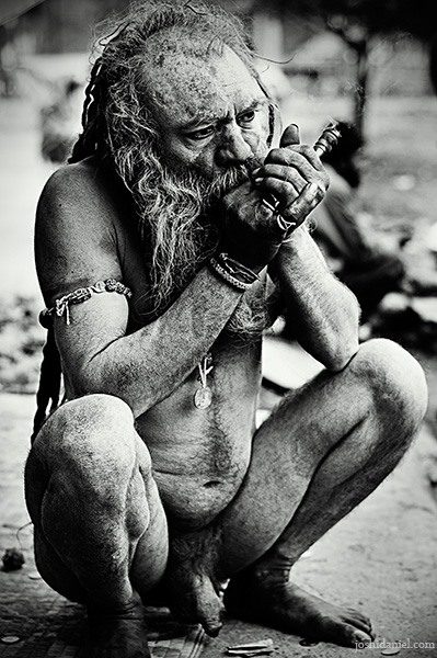 A naga sadhu smoking chillum during the Kumbh Mela 2010 in Haridwar