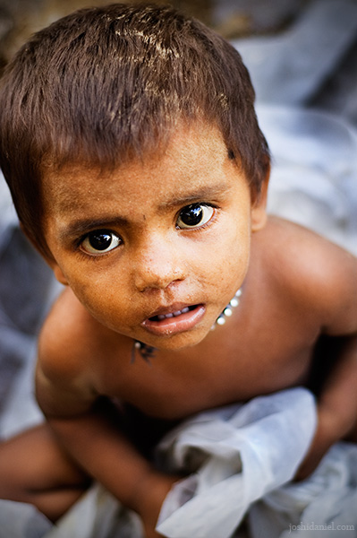 Wide-eyed portrait of a young boy from Worli in Mumbai