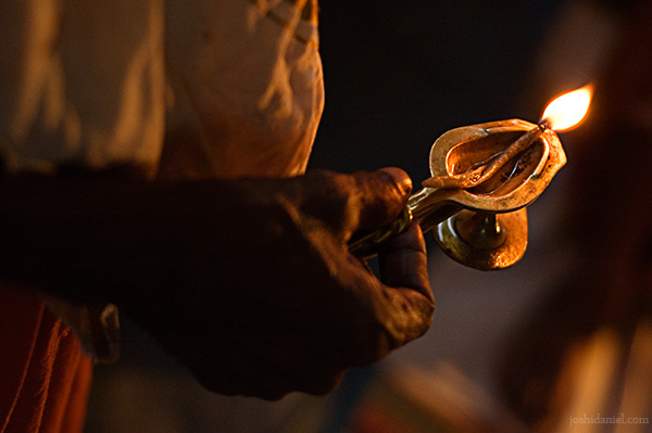 Man holding an oil lamp
