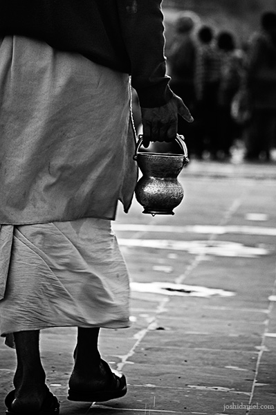 A pilgrim carrying holy water from ganga during kumbh mela 2010 in Haridwar
