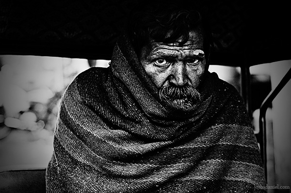 Portrait of a rickshaw wallah on a chilly day in Jaipur, Rajasthan