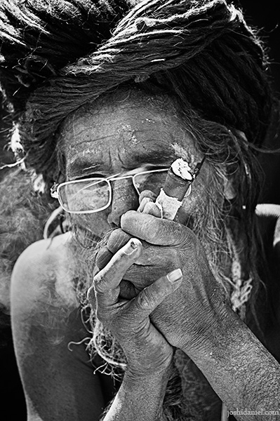A naga sadhu smoking chillum during the kumbh mela 2010 in haridwar