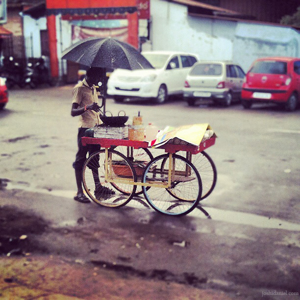 Peanut seller on a rainy day at Trivandrum in Kerala, India