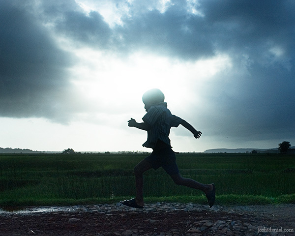 A running boy on a cloudy day from Kumta in Karnataka