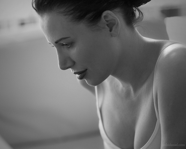 Black and white portrait of a girl looking down