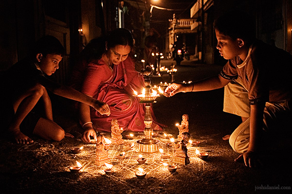 A family lighting up oil lamps during the Karthika Deepam festival in Trivandrum