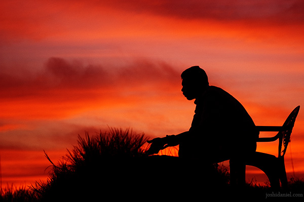 Silhouette of a lifeguard sitting at Kovalam beach in Trivandrum