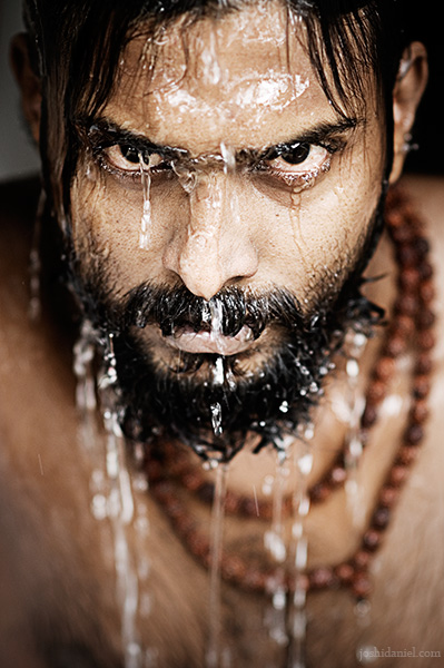 Portrait of Abilash Thankan gazing with water dripping from his face