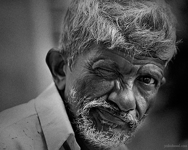Black and white portrait of a one eyed man from Trivandrum, Kerala