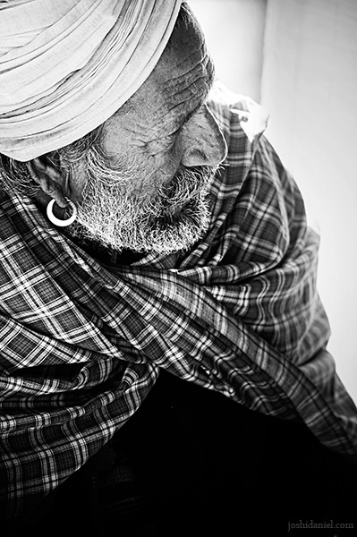 Black and white portrait of an old man in a turban from Rajasthan, India