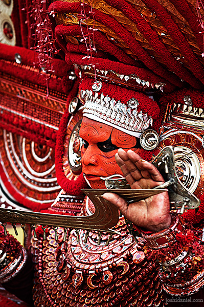 Portrait of muchilottu bhagavati theyyam performer holding a sword