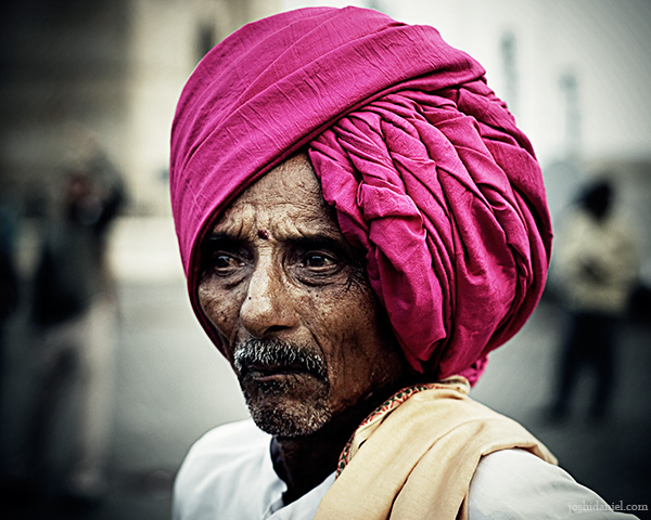 Portrait of an old man wearing a turban at Gateway of India, Mumbai