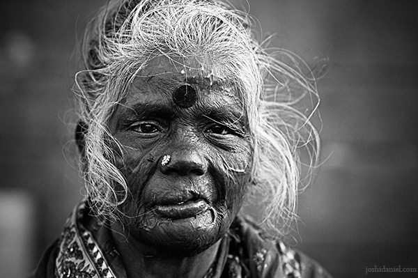 Black and white portrait of an old flower seller in Koyambedu market, Chennai