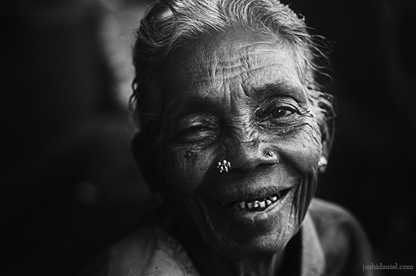 Black and white portrait of an old woman in Bangalore smiling