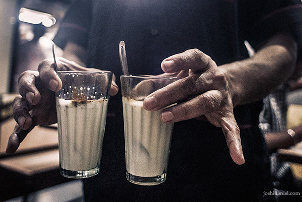 A man serving coffee at Hotel Shree Ram in Mahalaxmi, Mumbai