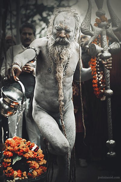 A Naga Sadhu performing a ritual in Kumbh Mela in Haridwar, India