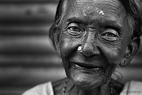 Black and white portrait of an old woman with an angelic smile from Trivandrum, Kerala