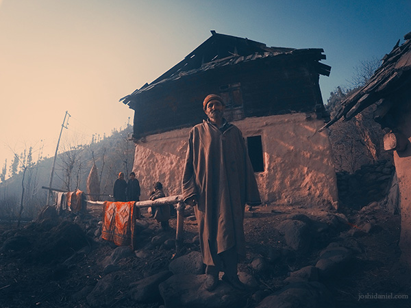 Portrait of a Kashmiri man standing in front of his house in Anantnag, Jammu and Kashmir