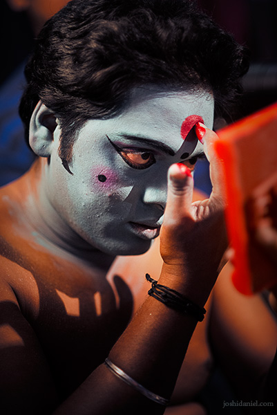 Portrait of a man doing his makeup for kattai koothu