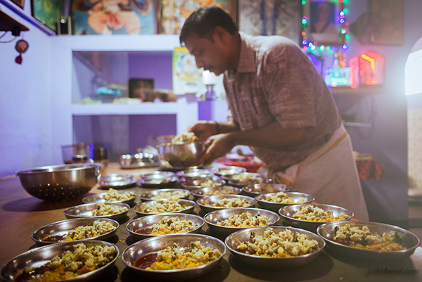 Dishes being plated up for the lunch service at Mani Mess in Trivandrum, Kerala