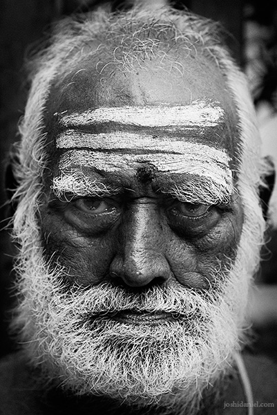 Black and white portrait of an old man in Mylapore, Chennai with vibhuti on his forehead