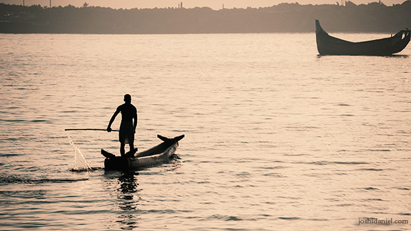 Fisherman rowing the boat in Vizhinjam, Trivandrum