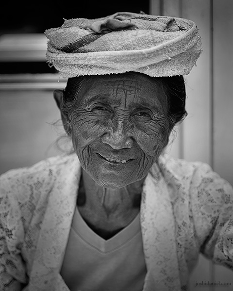 Black and white portrait of a smiling lady in Ubud, Bali