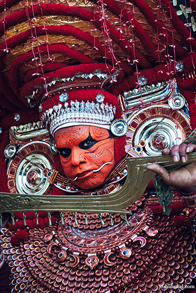 Portrait of muchilottu bhagavati theyyam performer holding a sword in Kannur, Kerala