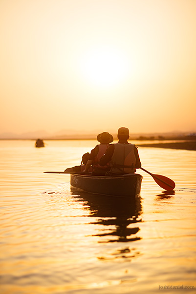 People going on a canoe ride in Satpura National Park at sunset