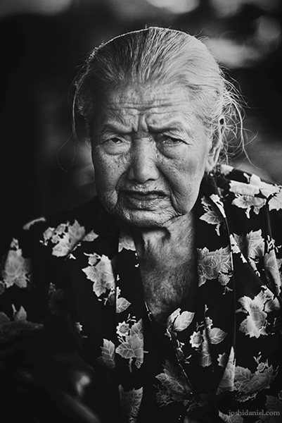 Black and white portrait of an old lady in Beringharjo market, Yogyakarta, Indonesia