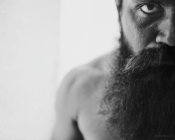Black and white Self-portrait of joshi daniel with a beard taken on a 28mm lens in Trivandrum, Kerala, India