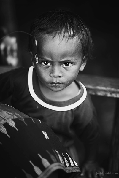 Black and white portrait of a young boy from Melo village, Flores, East Nusa Tenggara, Indonesia