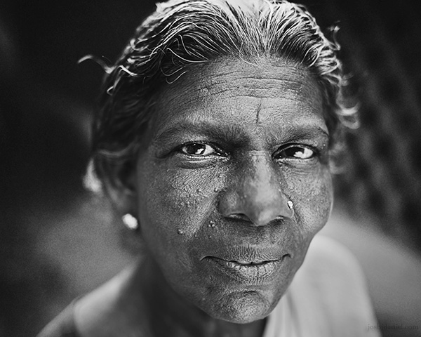 A 28mm wide angle black and white portrait of a smiling lady from Trivandrum, Kerala, India