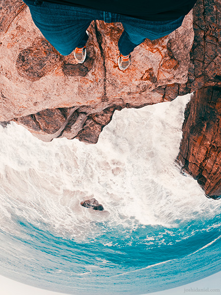GoPro self-portrait of joshi daniel on the edge of a cliff by the sea in Trivandrum, Kerala, India