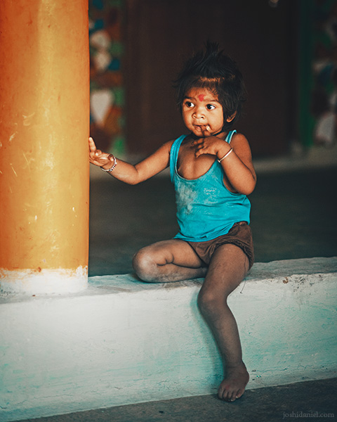 Portrait of a young girl child lost in deep thought in Sohagpur, Hoshangabad, Madhya Pradesh, India