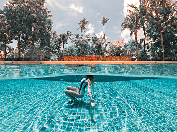 A GoPro HERO7 Black over/under photo of Larissa Dsa in the swimming pool in Ko Samui, Thailand