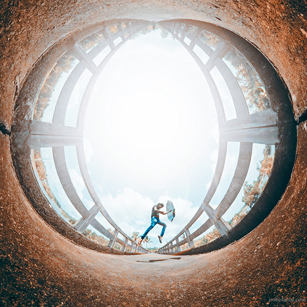 Inverted little planet (tiny planet) photograph of Abilash Thankan jumping with an umbrella at Cheriyanad, Chengannur, Alappuzha, Kerala, India