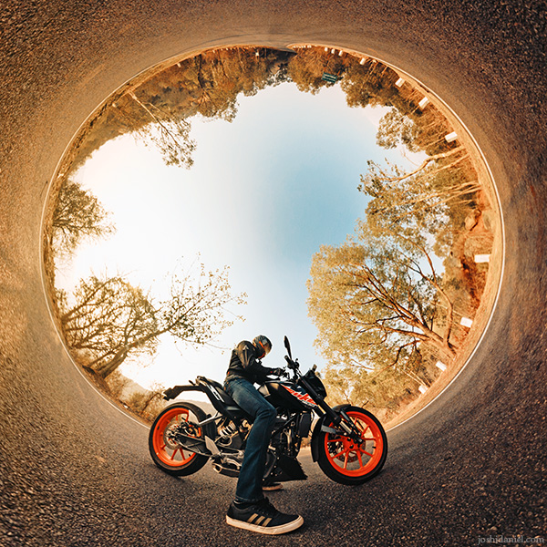 Inverted little planet (tiny planet) self-portrait of joshi daniel on KTM Duke in Tumkur, Karnataka, India