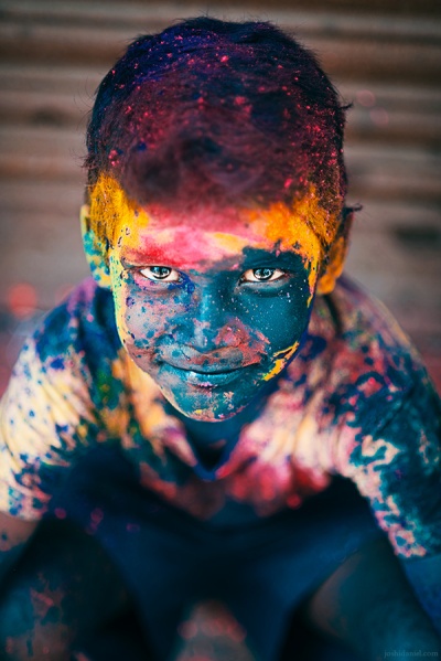 A vibrant portrait of a boy during the festival of Holi in Sowcarpet, Chennai, Tamil Nadu, India