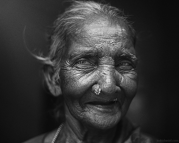 Black and white portrait of a smiling Govindamma taken at Prasad studio in Saligramam, Chennai, Tamil Nadu, India