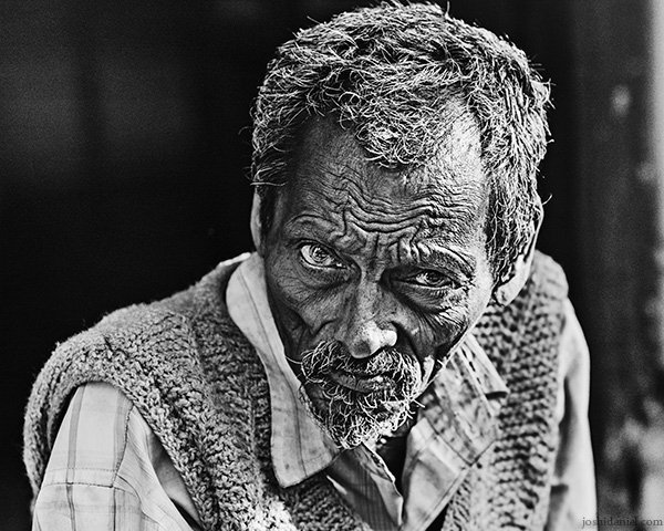 Black and white street portrait of a man in Allahabad, Uttar Pradesh, India
