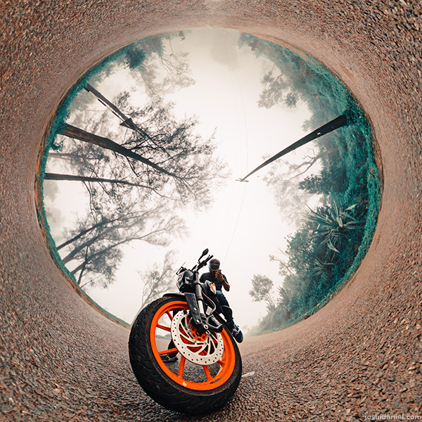 Inverted little planet (tiny planet) self-portrait of joshi daniel on KTM Duke in Ponmudi, Trivandrum, Kerala, India